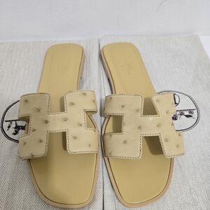 Hermes Oran Ostrich Flat Sandals in Cream/Yellow, Size 38. NEW
